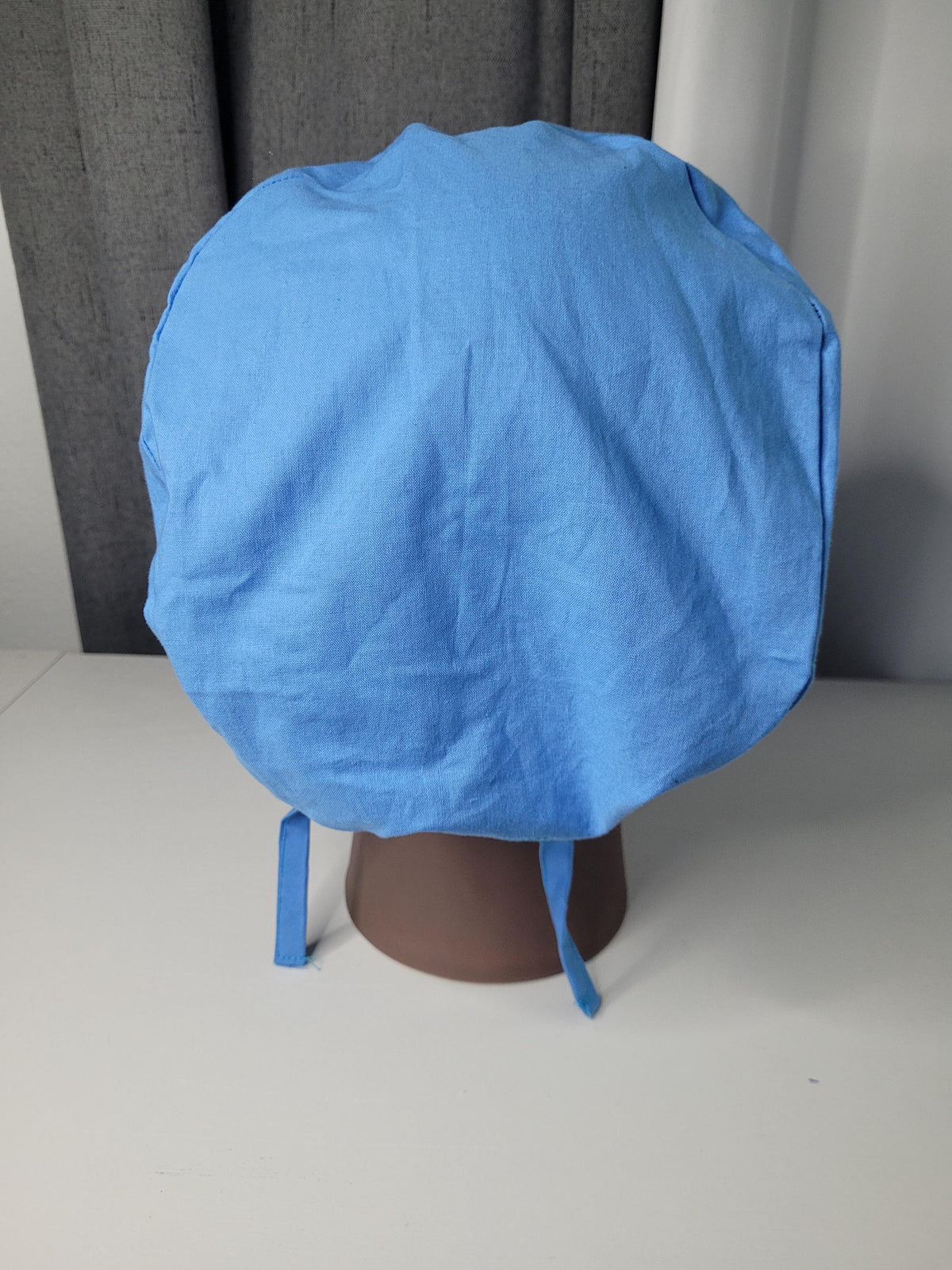 Scrub Cap: 100% Cotton Solid L. Blue, Satin Lined and Button Ear Savers options